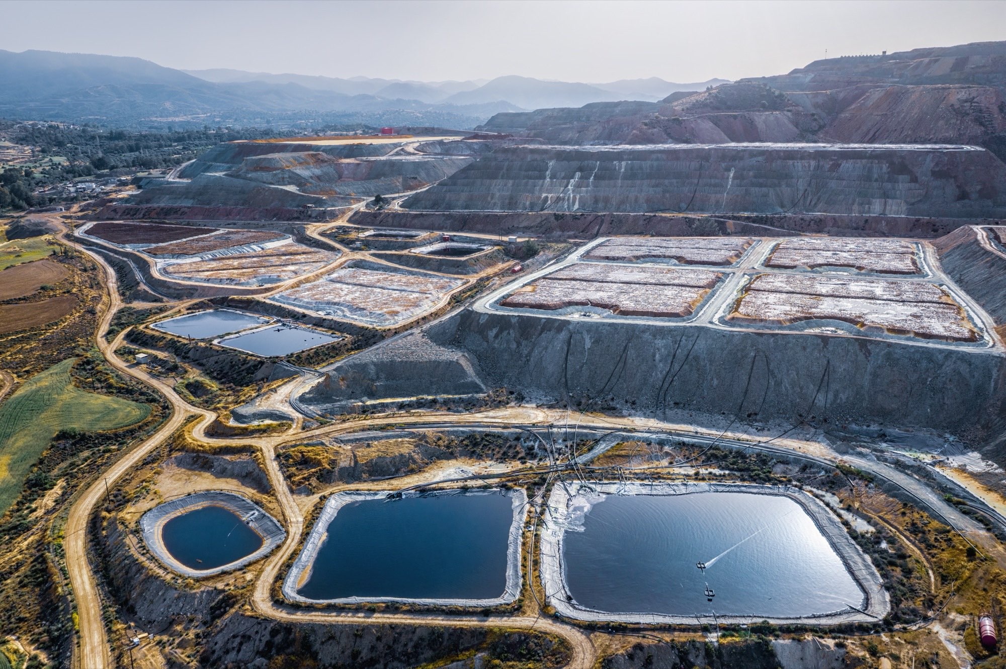 Aerial view of heap leach pads and solution ponds at a copper mine